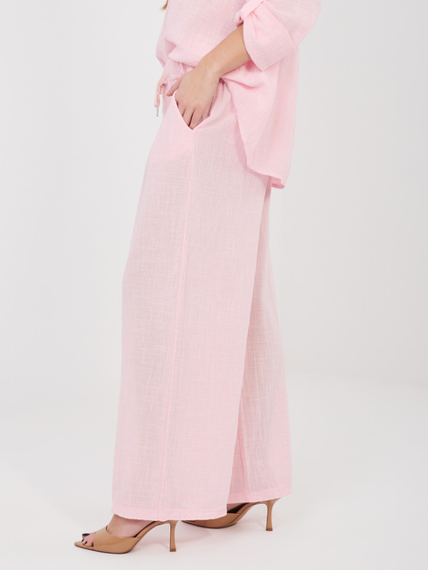 Jasnoróżowe letnie spodnie z wiązaniem