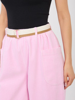 Pastelowe różowe sztruksowe spodnie bez zapięcia