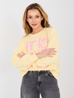 Pastelowa żółta bluza z kontrastowym napisem RUE PARIS 
