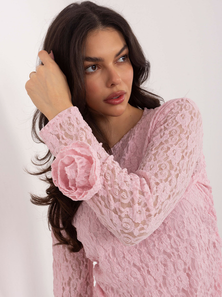 Light pink blouse with decorative roses.