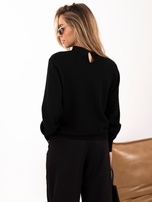 Schwarzer Damenpullover mit Spitzenkragen.