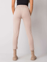 Beżowe spodnie dresowe z napisami Peyton