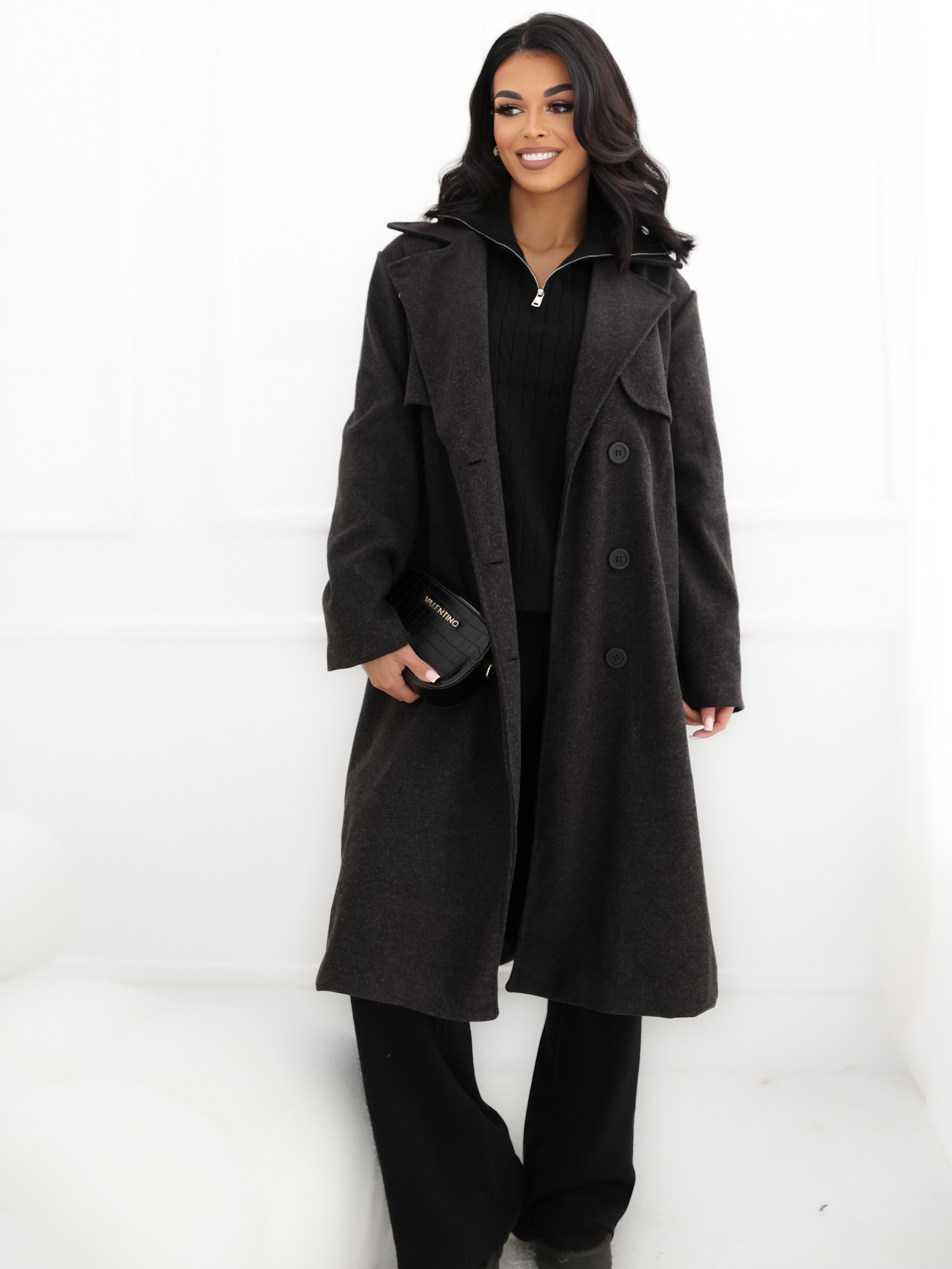 Black transitional knee-length coat.