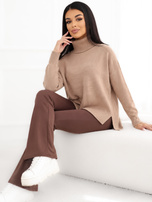 Dark beige oversized sweater with a longer back.