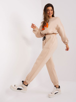 Hurt Beżowo-fluo pomarańczowy komplet dresowy z naszywką