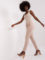 Hurt Beżowe damskie spodnie dresowe z lampasami