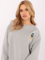 Hurt Jasnoszara bluza oversize z naszywką misia