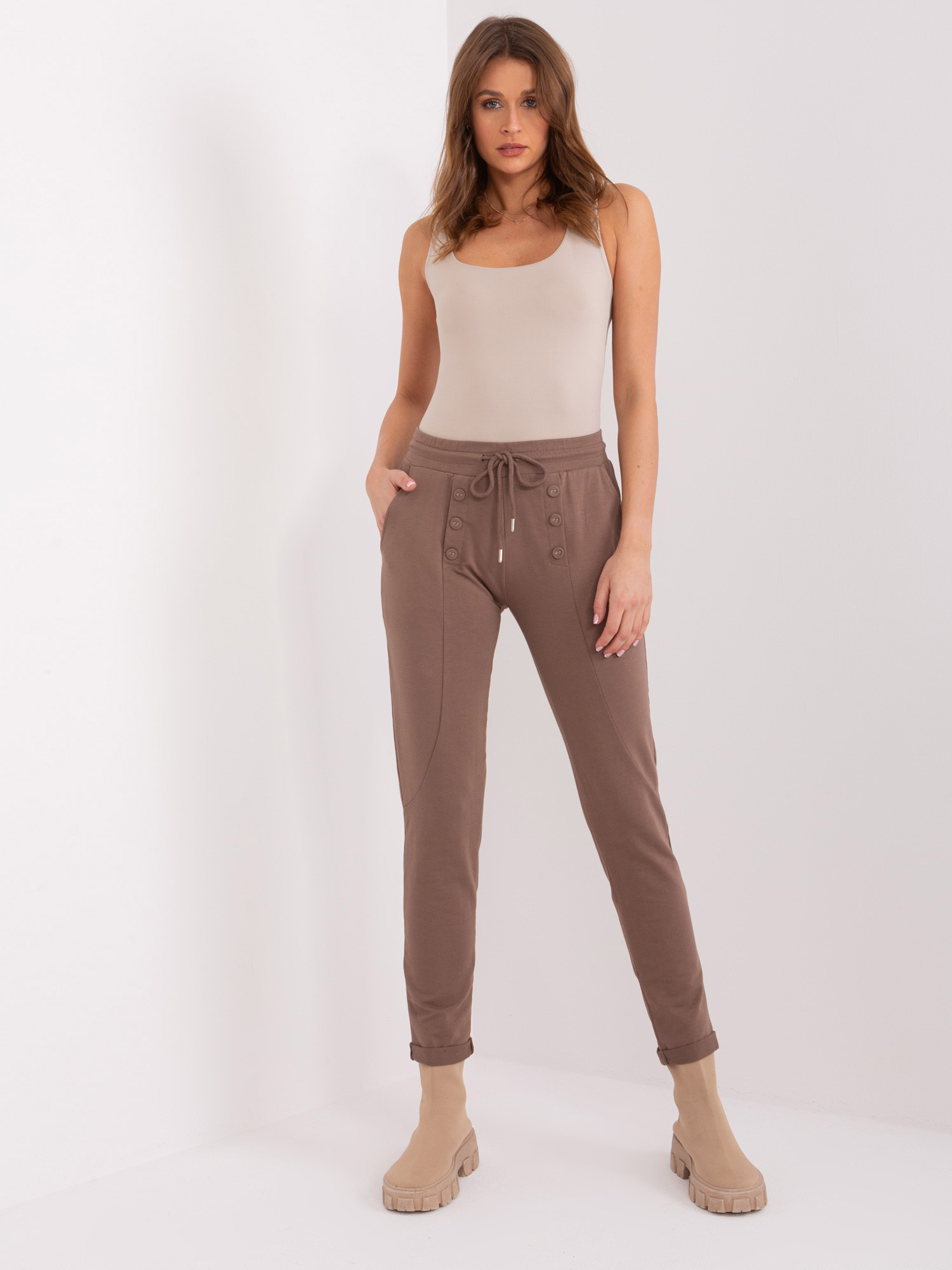 Hurt brown sweatpants with straight legs.