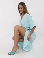 Mint muslin dress with a wrap neckline.
