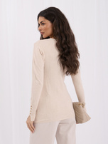 Beige women's sweater with buttons on the sleeves.