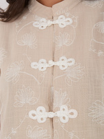 Beige women's blouse in Chinese style.