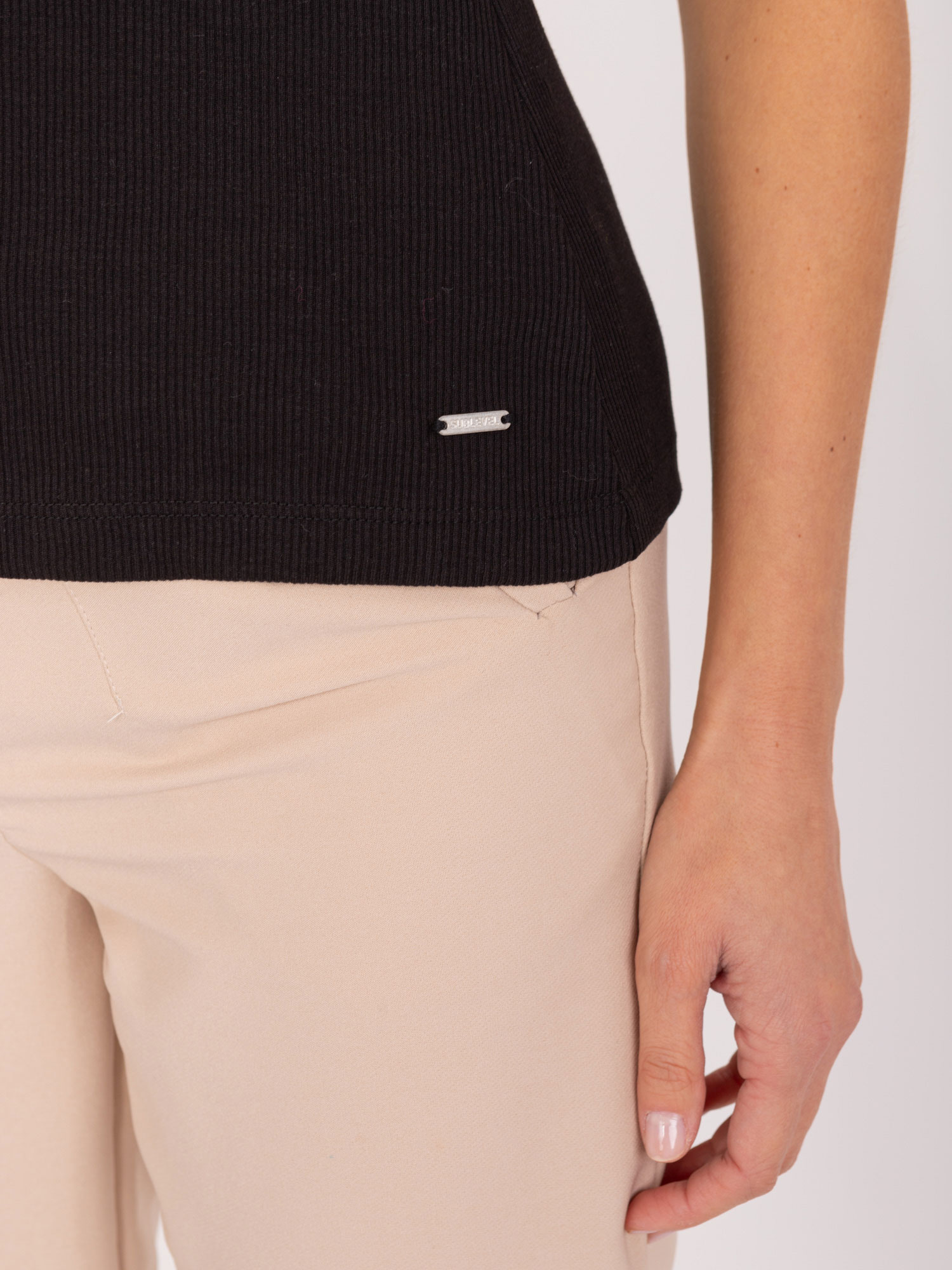 Hurt Black women's top with V-neck SUBLEVEL.
