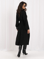 Black shirt dress with detachable brooches.