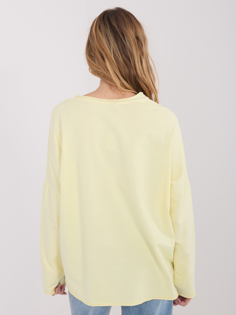 Jasnożółta bluzka z kwiatową aplikacją 3D
