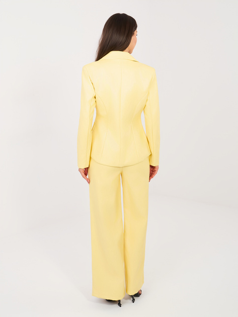 Jasnożółte spodnie z ekoskóry z gumką w pasie