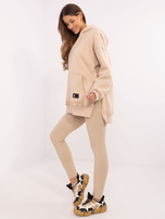 Beige three-piece set with a warm hoodie.