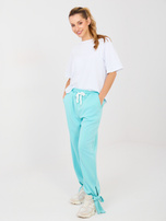 Miętowe dresowe spodnie z kieszeniami