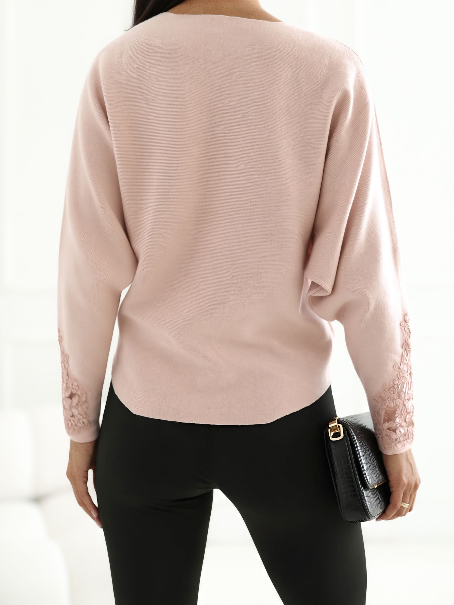 Light pink women's sweater with lace.