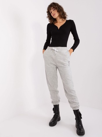 Light gray sweatpants with SUBLEVEL print.