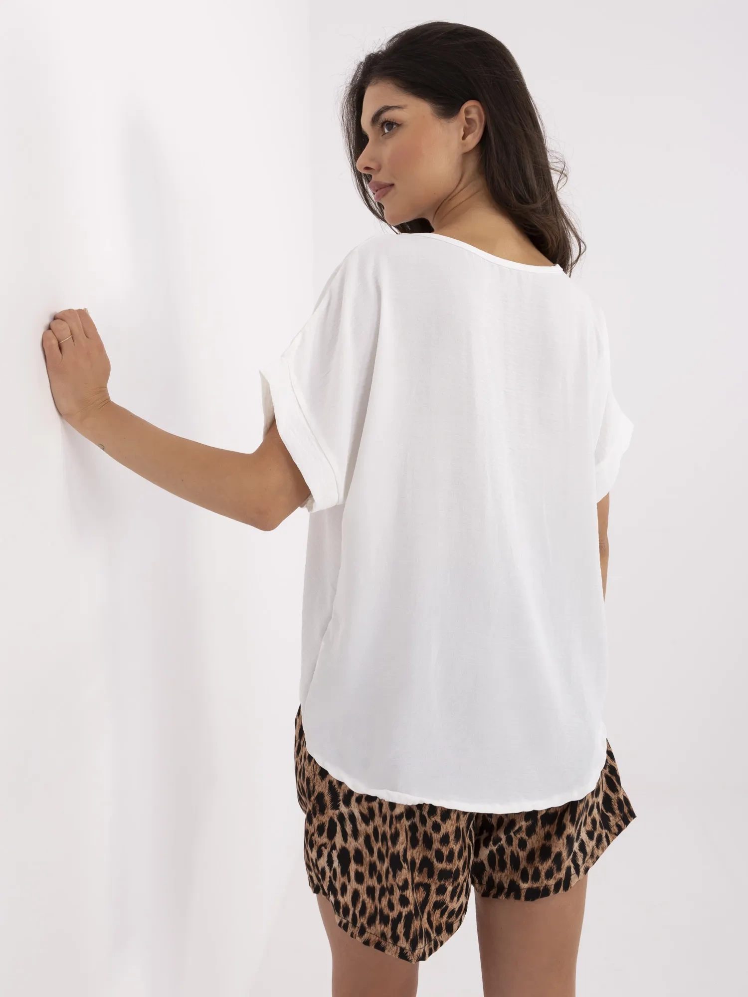 Ecru summer set with leopard print shorts.