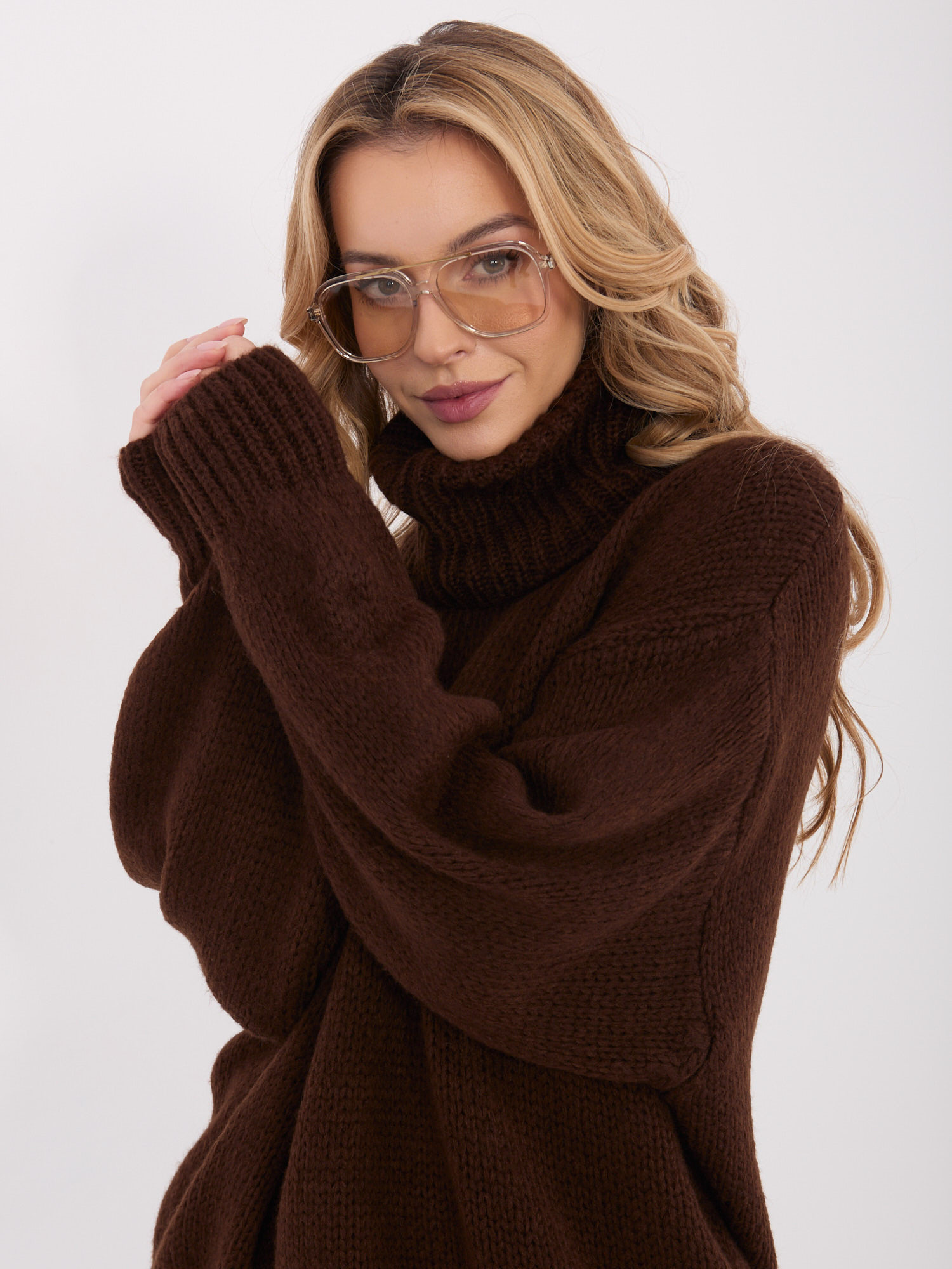 Dark brown women's oversized turtleneck sweater.
