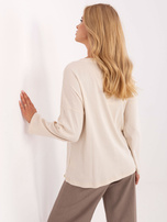 Jasnobeżowa bluzka oversize z długim rękawem