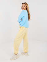 Pastelowe żółte dresowe spodnie typu jogger