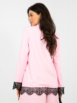 Pastel pink blazer with bell sleeves.