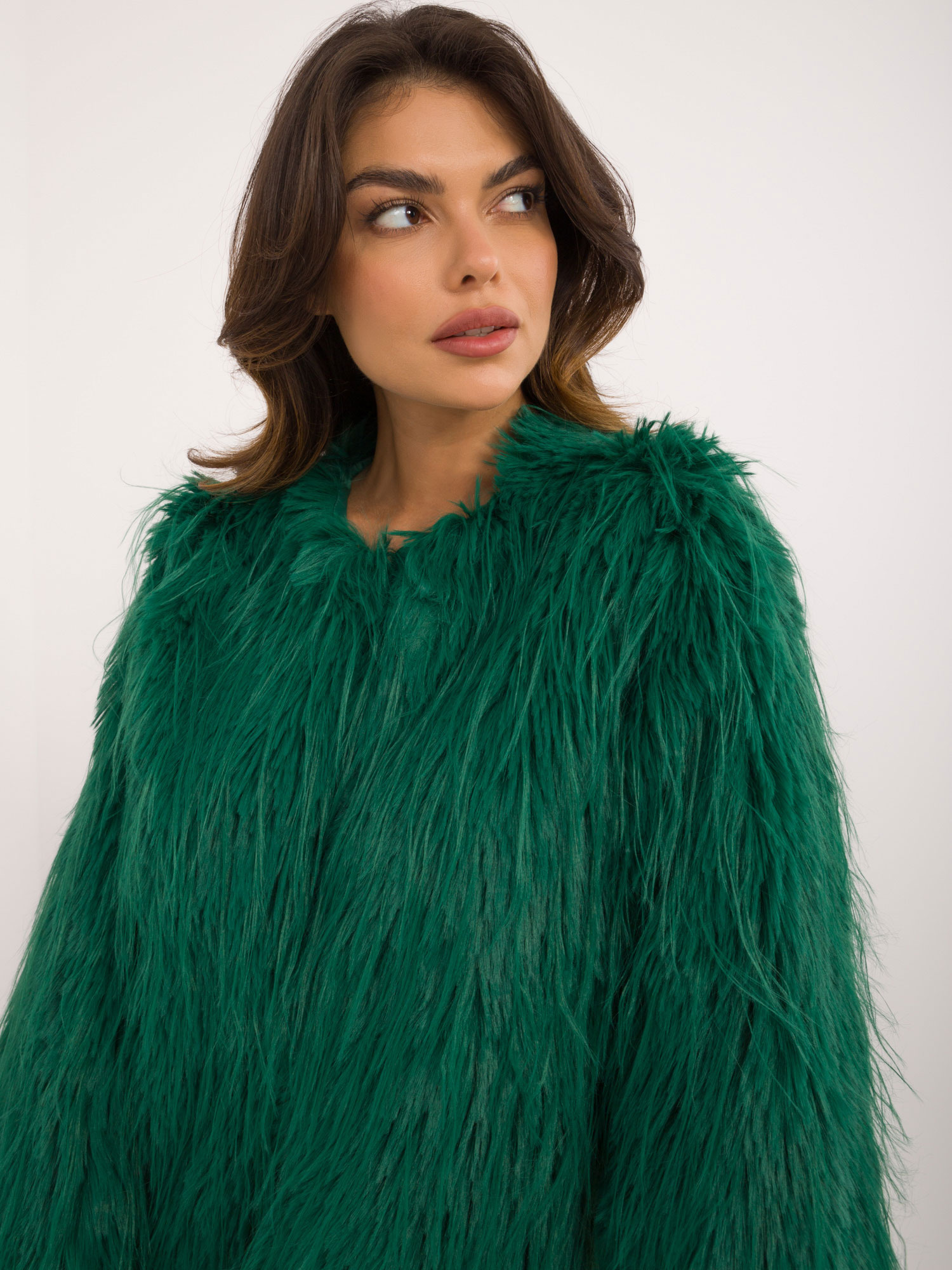 Hurt green women's fur jacket fastened with hooks.