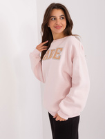 Hurtownia Jasnoróżowa bluza bez kaptura z napisem