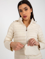 Hurt Jasnobeżowa przejściowa kurtka pikowana z kapturem i torebką 