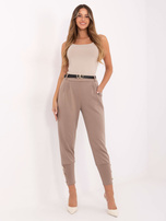 Beżowe zwężane spodnie dresowe z kieszeniami