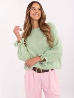 Hurtownia Pistacjowy sweter falbankami przy rękawach