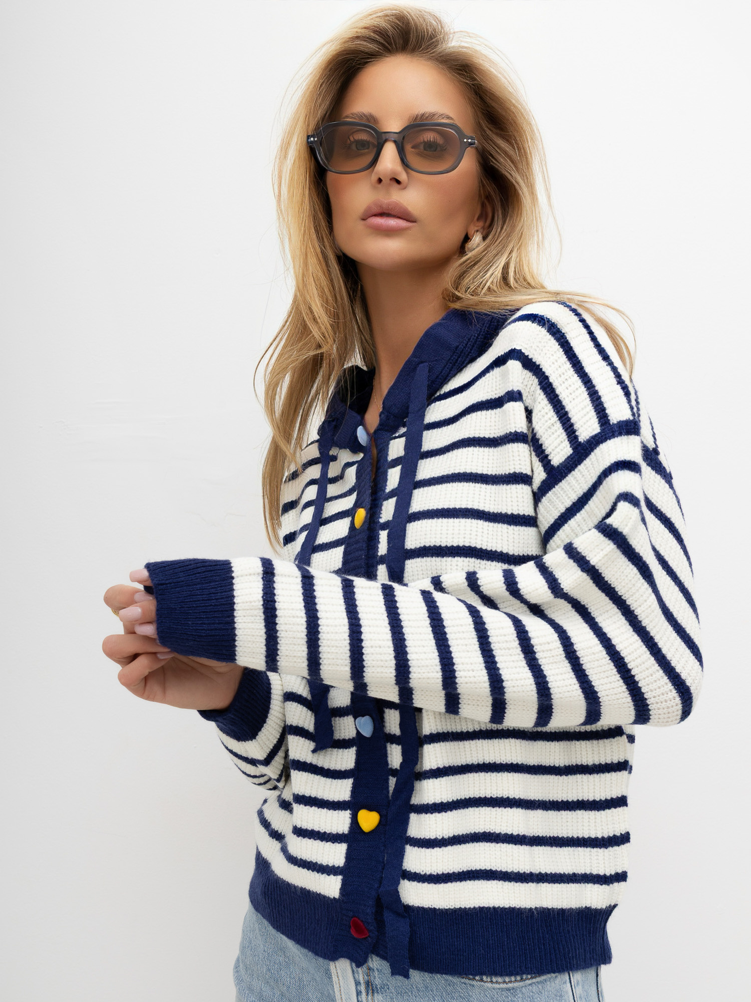 Navy sweater with decorative heart-shaped buttons.