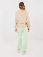 Pastelowe zielone dresowe spodnie bez zapięcia 