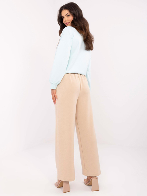 Hurt Beżowe dresowe spodnie z przeszyciem w kant