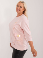 Light pink plus size blouse with an application and inscription.