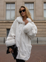 Ecru oversized fur coat with a decorative collar.