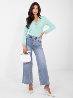 Miętowa dopasowana bluzka w prążek 