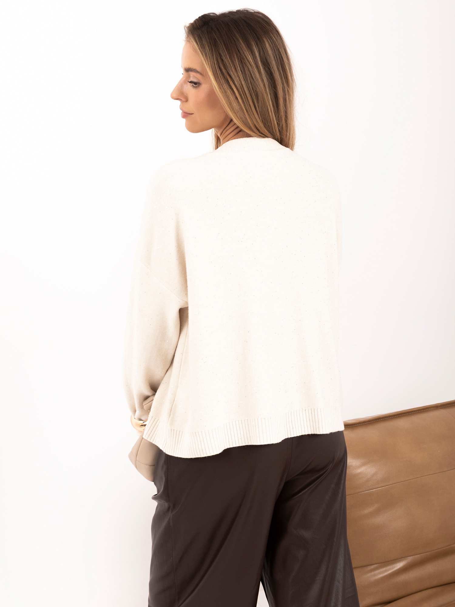 Light beige elegant cardigan with large buttons.