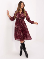 Burgundy pleated dress with a belt.