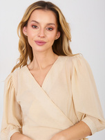 Beżowa kopertowa sukienka z falbaną 