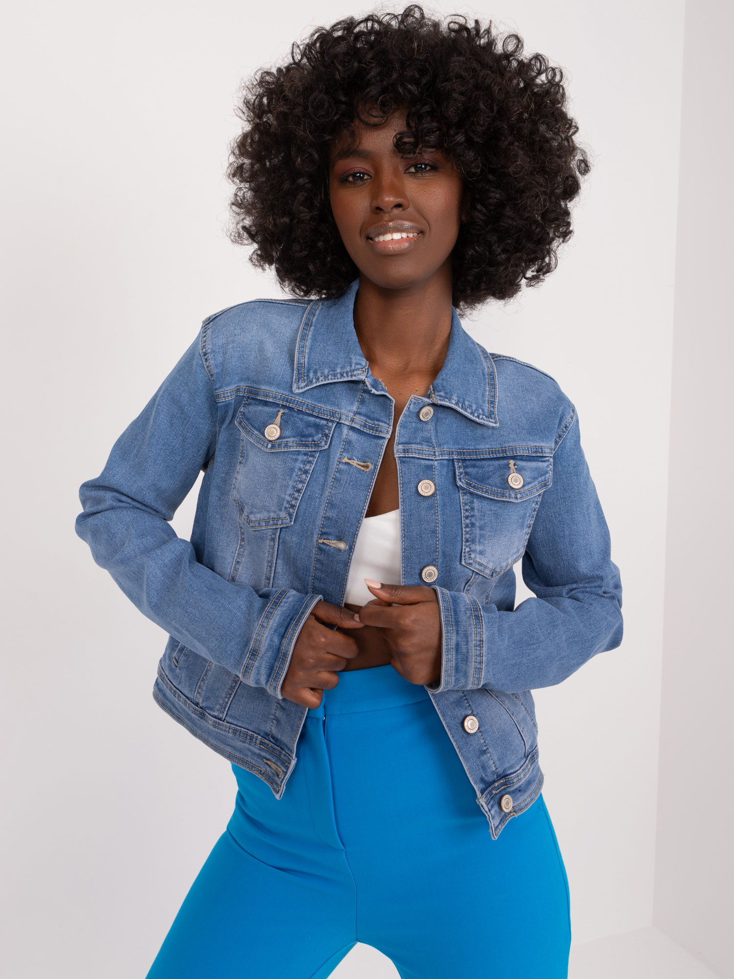 Wholesale Blue denim jacket with buttons.