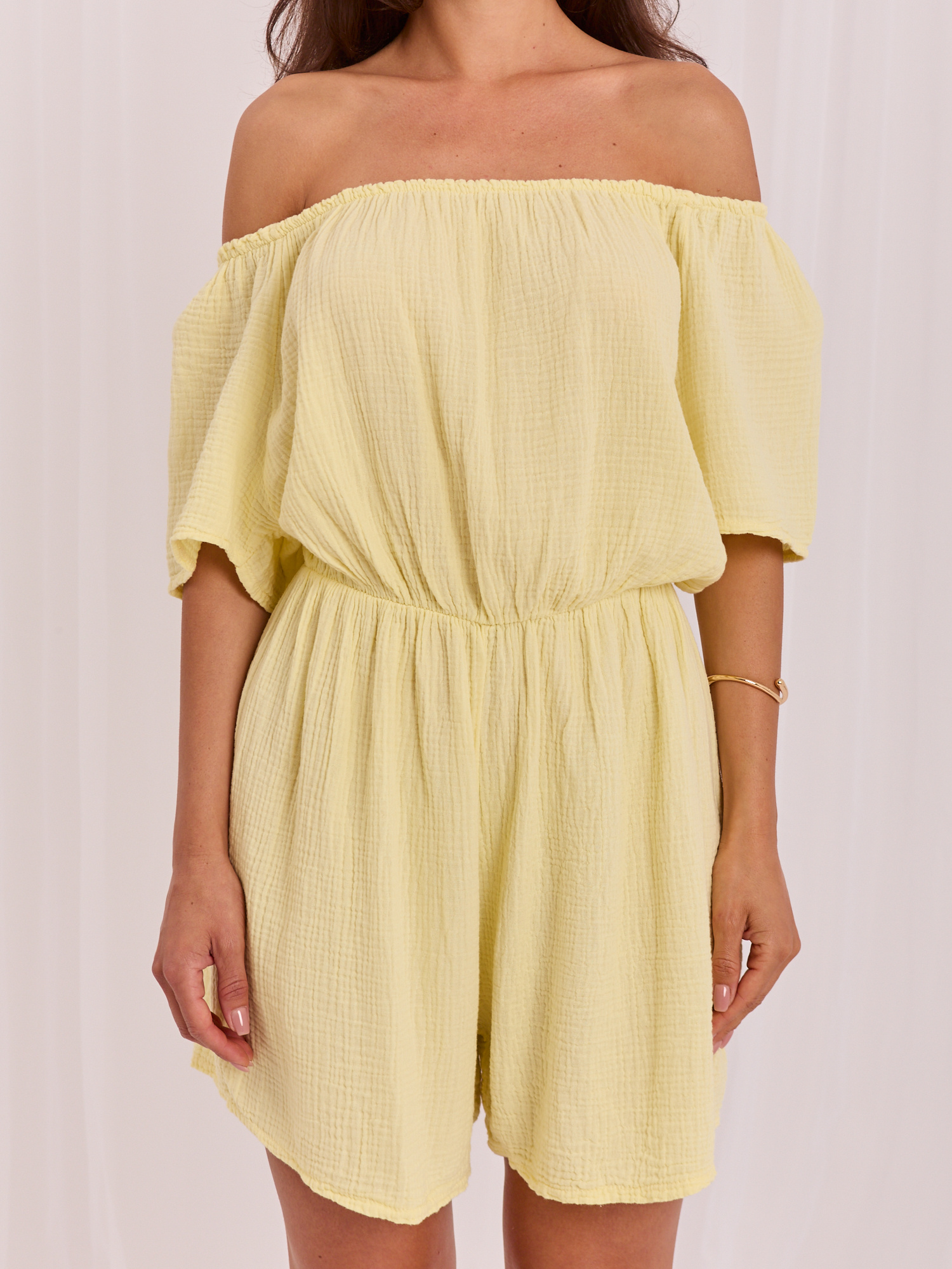 Light yellow jumpsuit Spanish style made of muslin.
