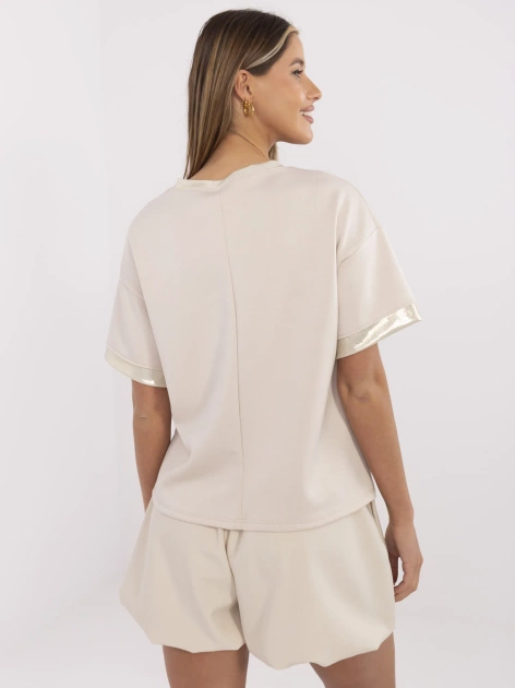 Beżowa bluzka z błyszczącymi wstawkami