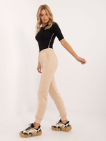 Hurtownia Beżowe ocieplane spodnie dresowe z kieszeniami