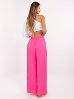 Pink structural pants with an elastic waistband.