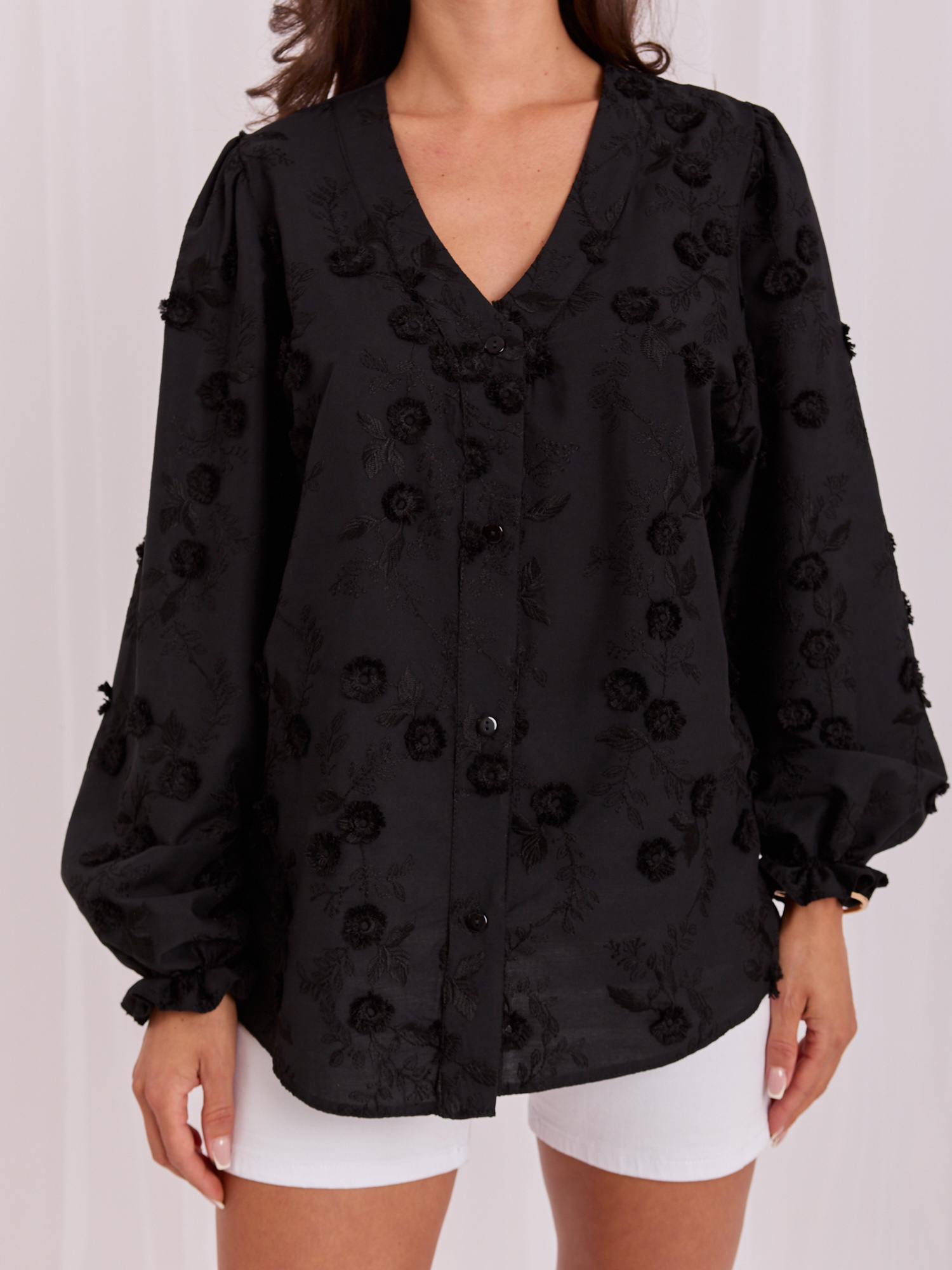 Black elegant blouse with embroidery.