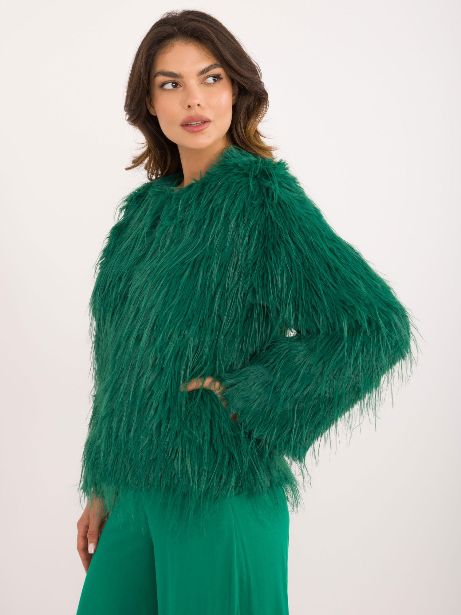 Hurt green women's fur jacket fastened with hooks.
