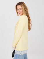 Pastelowa żółta elegancka marynarka z zapięciem na guzik